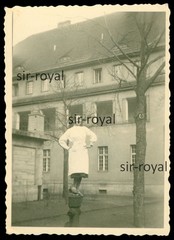 Pretty Nurse Balancing On Hydrant In Front Of Hospital – Photo 6x8cm