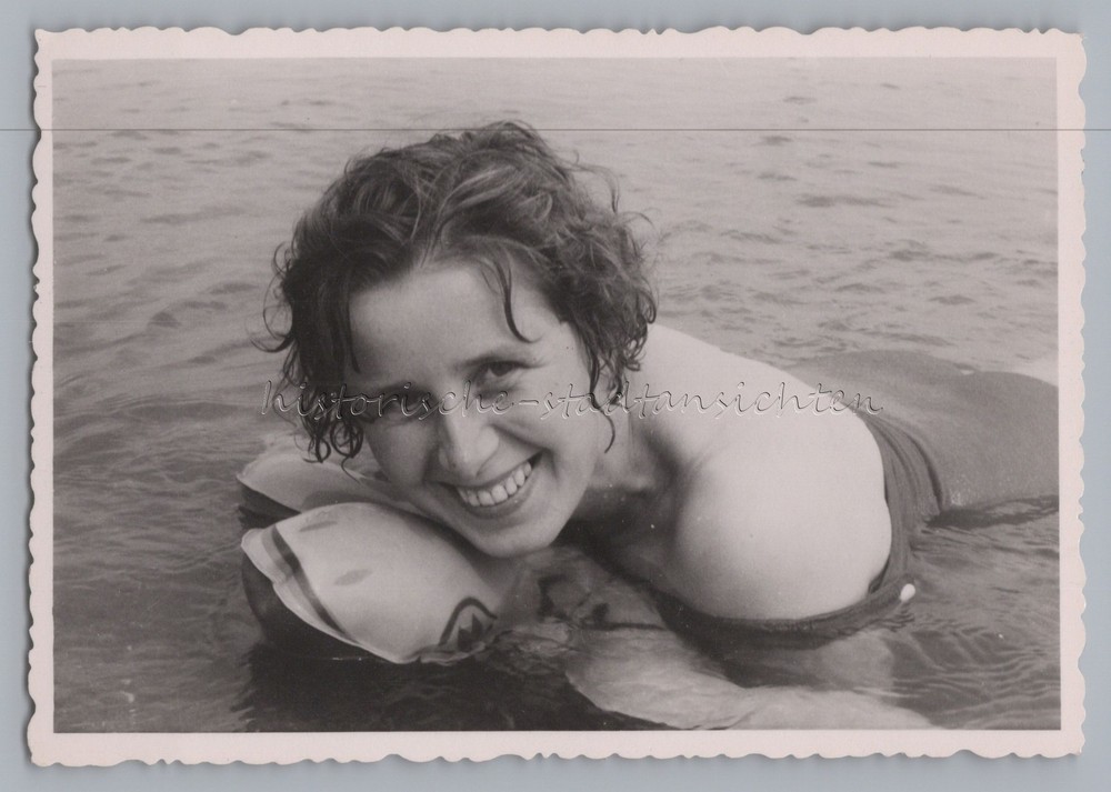 Beautiful shot of woman on air mattress – bathing leisure – old photo