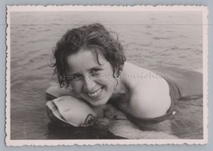 Beautiful shot of woman on air mattress – bathing leisure – old photo