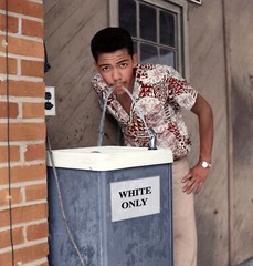 Cecil Williams Drinking from White Only Water Fountain