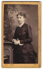 Photograph Carl L. Koch, Saaz, Ringplatz 42, young woman in fitted dress mi