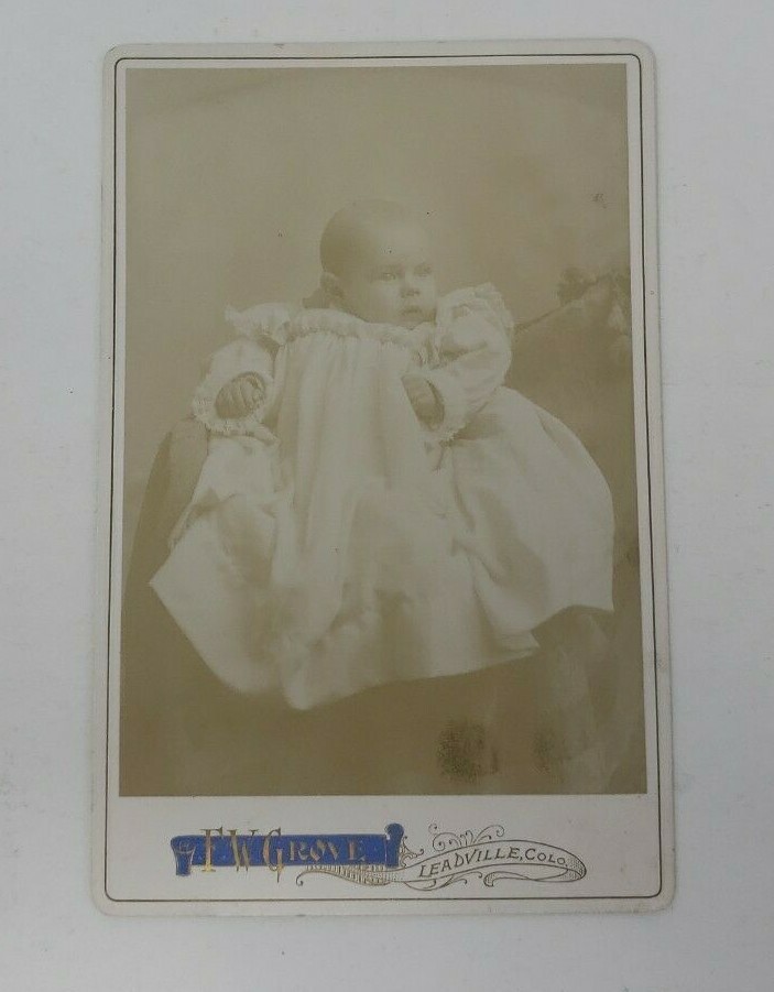 Antique Cabinet Card Photograph- Baby in a white dress sitting for a photograph