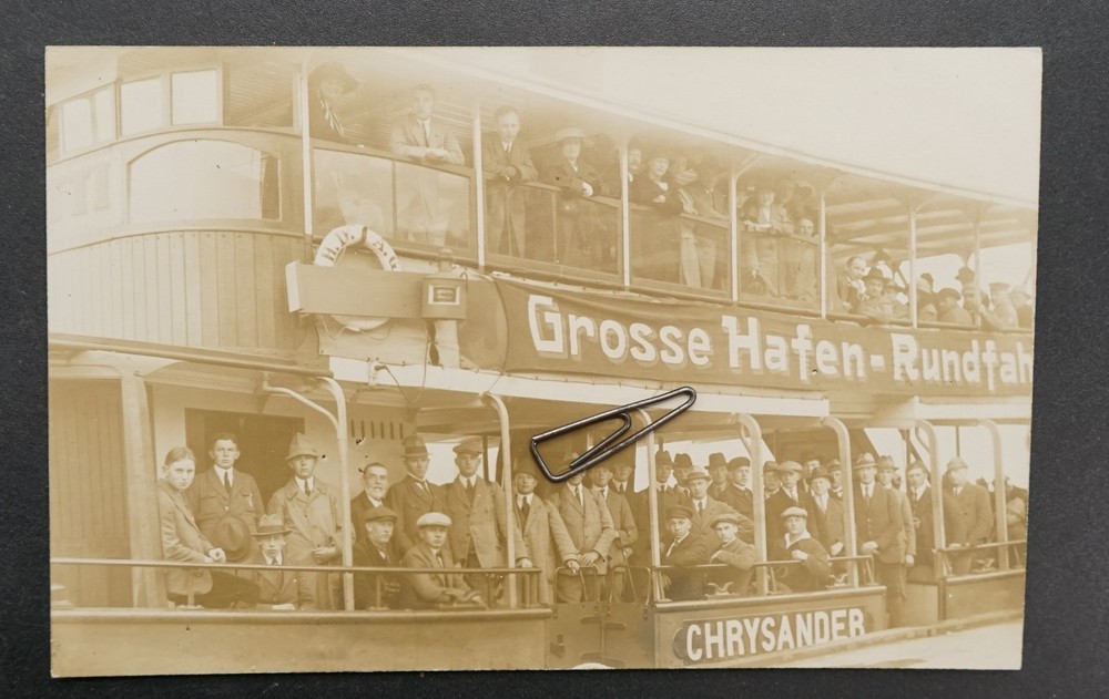 Photo portrait steamboat ride port of Hamburg advertising people hat model men picture