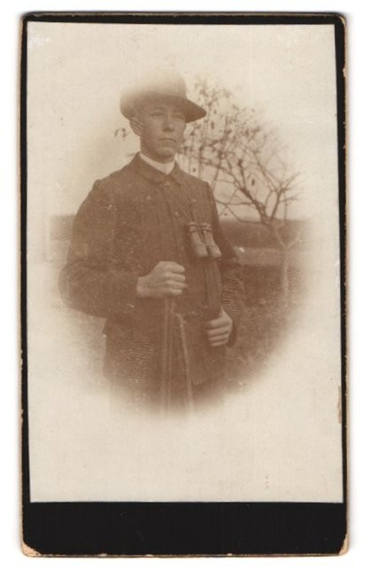 Photography Hunter with Binoculars and Rifle on Foot