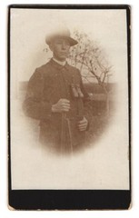 Photography Hunter with Binoculars and Rifle on Foot