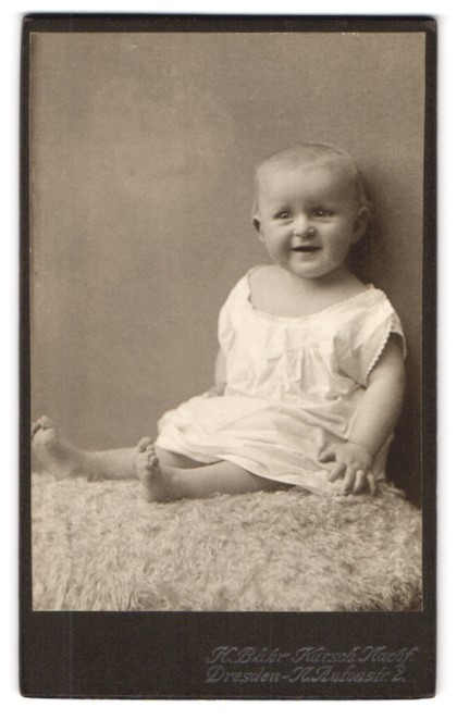 Photograph Herm. Bähr, Dresden, Antonstraße 2, baby in white on animal fur