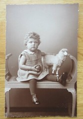 7 old portrait photos little girl with toy / ball and sheep around 1920