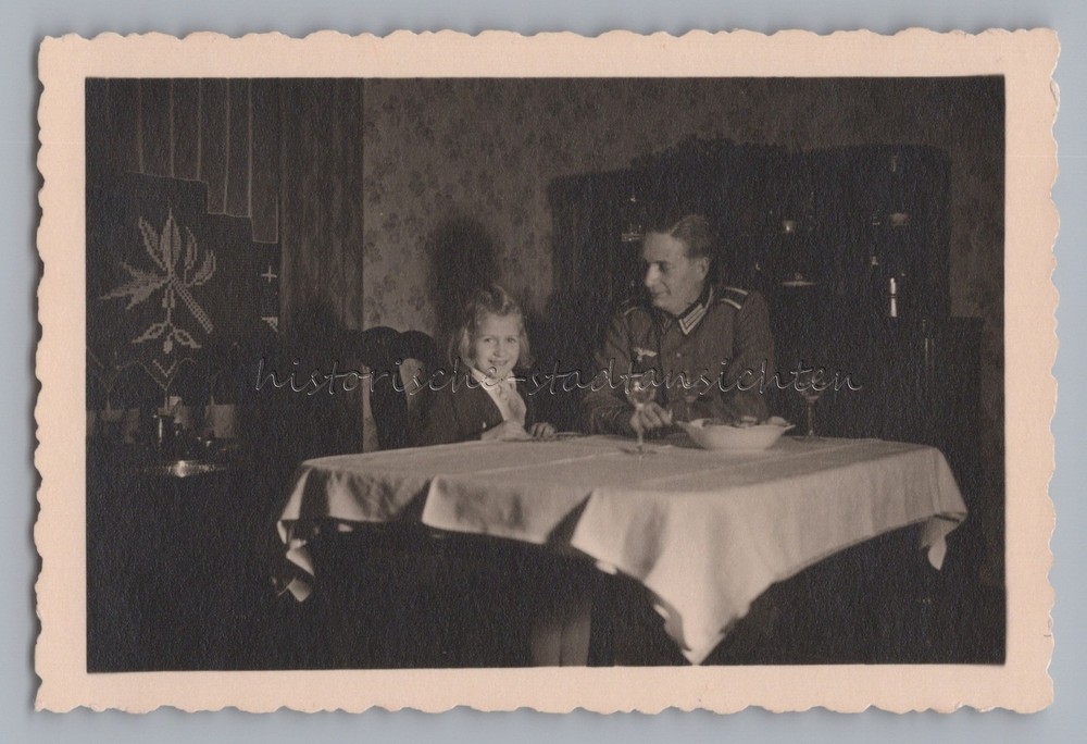 Girl with cock comb hairstyle with father in Wehrmacht uniform on 27.12.1942 photo