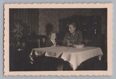 Girl with cock comb hairstyle with father in Wehrmacht uniform on 27.12.1942 photo