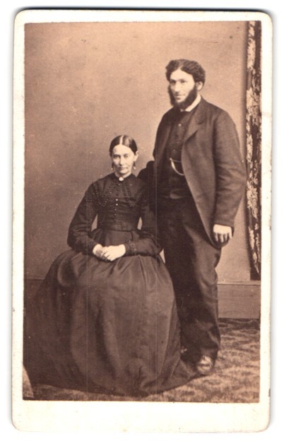Photograph Sitting Couple with Standing Person