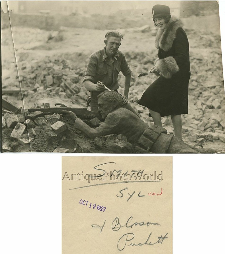 Yougn sculptor carving soldier statue antique photo