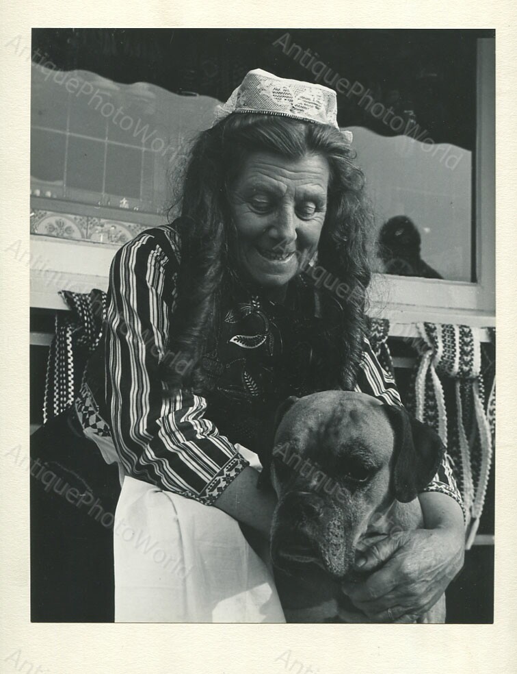 Old woman in ethnic dress w dog art photo by Levinsohn