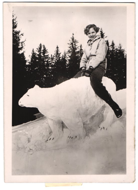 Photograph young woman sitting on polar bear from snow 1940