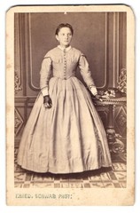 Photograph F. Ried, young girl in bright wide dress with fingerless hands