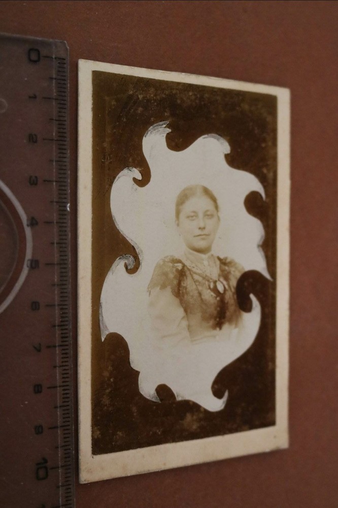 Great old photo on cardboard portrait of a woman photo montage?