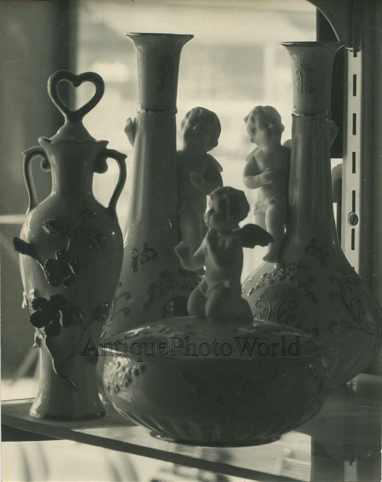 Still life with statuette vases antique art photo