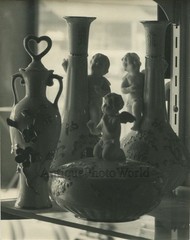 Still life with statuette vases antique art photo