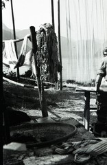 Salzkammergut , Austria, village, woman w traditional fishing net, by Eduard PEZ