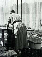 Salzkammergut , Austria, village, woman w traditional fishing net, by Eduard PEZ