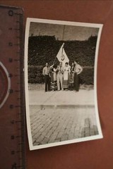 Great old photo – men in uniform – unknown and women in costume – country?