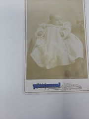 Antique Cabinet Card Photograph- Baby in a white dress sitting for a photograph