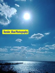DESKTOP BACKGROUND PICTURE BLUE SKY WITH SUN AND CLOUDS AND LAKE VERTICAL FORMAT