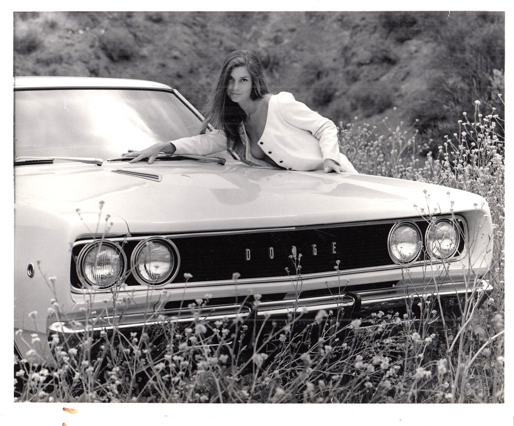 SEXY GIRL LEANING ON A DODGE CAR – B/W 8X10 PHOTOGRAPGH –