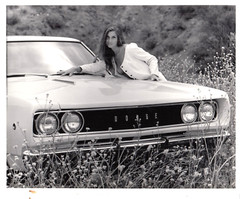 SEXY GIRL LEANING ON A DODGE CAR – B/W 8X10 PHOTOGRAPGH –