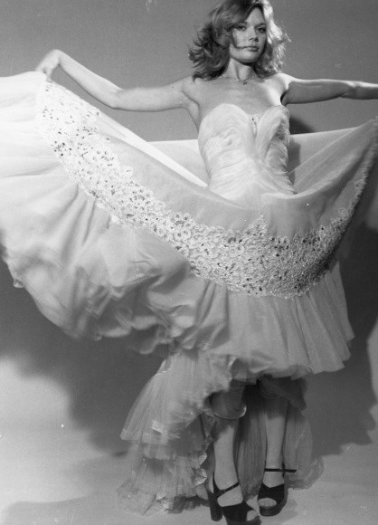 Photo Lilo Korenjak, Woman in Ball Gown Raises Skirts, Platform Sandals – 10550721