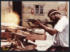 Larger size fine art Photograph, strong man w machine gun movie photo, 1970’s