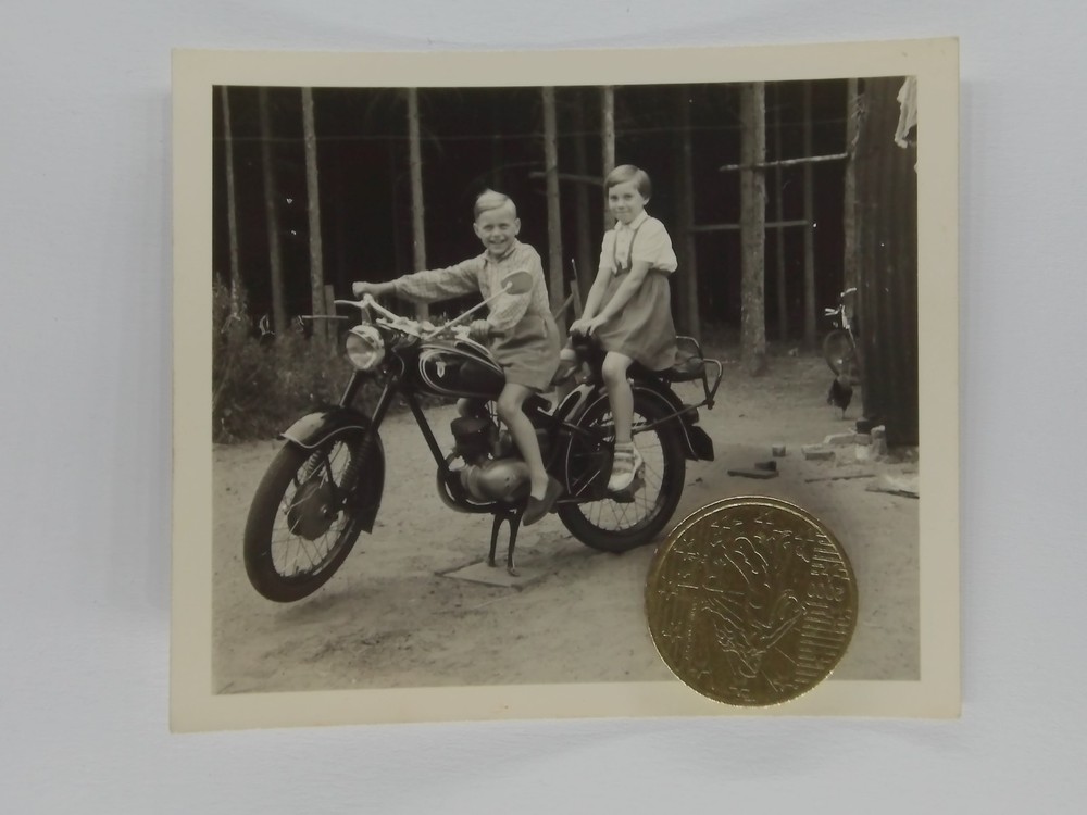 Photo boy and girl on motorcycle DKW 1950s