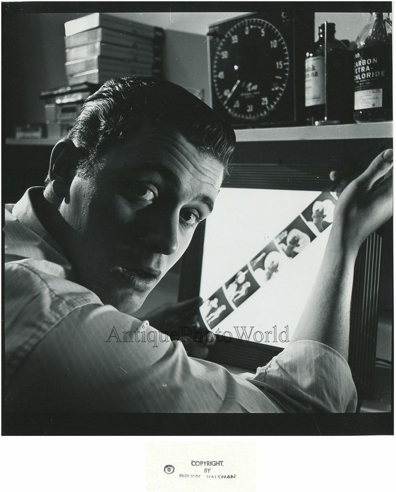 Young photographer in studio with film vintage photo by Philippe Halsman