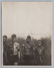 Boy with mud smeared in reeds – vintage photo 1930s