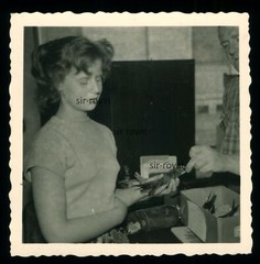 Woman holding extraordinary bird in hand being fed – Photo 6x6cm