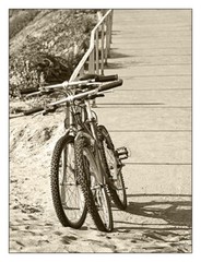 Two Bikes On The Beach In Sepia 12″ x 16″ Fine Art Print