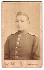 Photograph Carl Wolf, Harburg, at the war memorial, portrait of a soldier